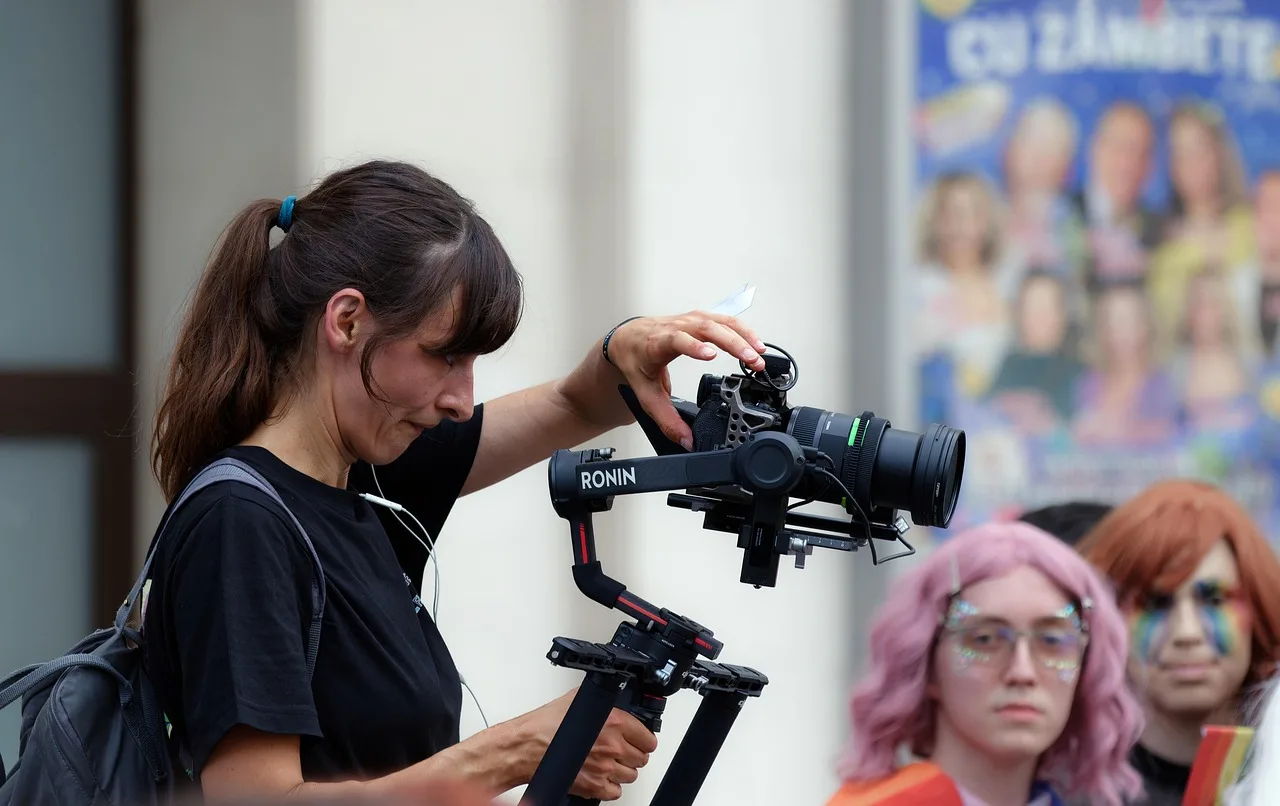 woman, reporter, photographer, cameraman, people, tripod, stabilize, backpack, job, professional, event, pride